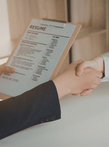 Professional reviewing candidate resume during hiring process